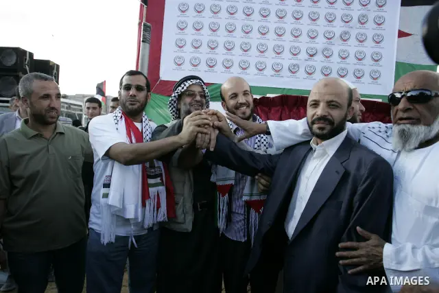 Palestinians and the members of ''Miles of Smiles 6" aid convoy take part in the opening ceremony of the memorial for Egyptians who killed during the 6 Arab-Israeli war in 1973 in Rafah, southern Gaza Strip on Oct. 6,201...