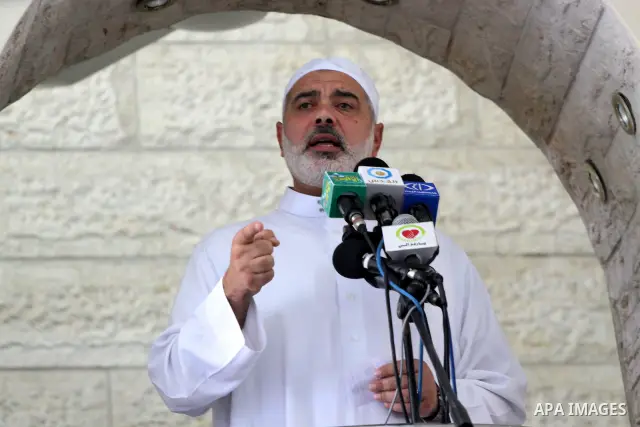 Palestinian Prime Minister in Gaza Strip, Ismail Haniya attends Friday prayers with the members of ''Miles of Smiles 6" aid convoy in Gaza city on Oct. 7,2011. Photo by Mohammed Asad