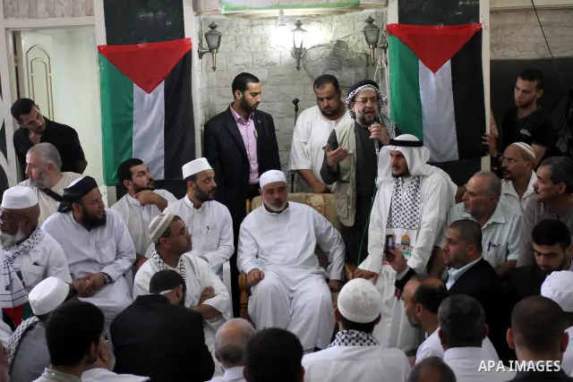 Palestinian Prime Minister in Gaza Strip, Ismail Haniya attends Friday prayers with the members of ''Miles of Smiles 6" aid convoy in Gaza city on Oct. 7,2011. Photo by Mohammed Asad