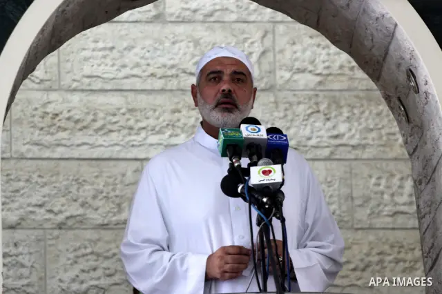 Palestinian Prime Minister in Gaza Strip, Ismail Haniya attends Friday prayers with the members of ''Miles of Smiles 6" aid convoy in Gaza city on Oct. 7,2011. Photo by Mohammed Asad