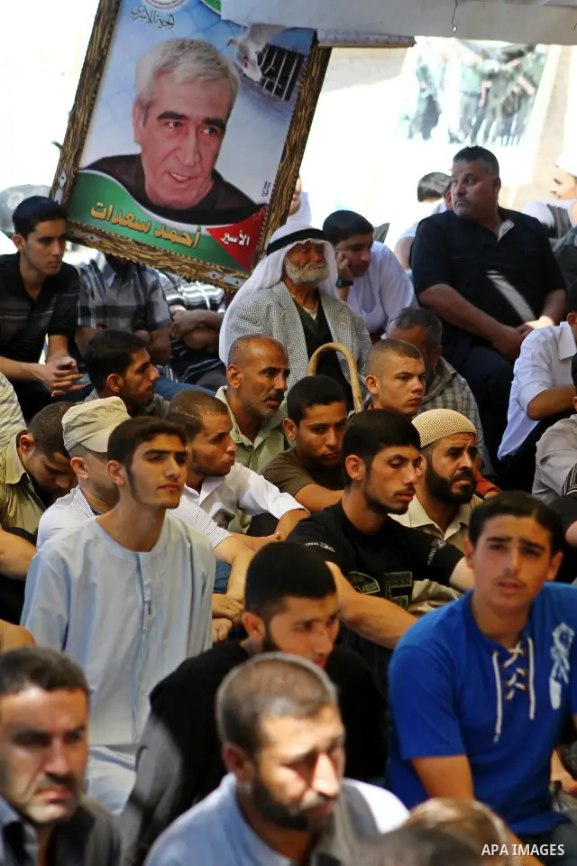 Palestinian Muslim worshippers attend Friday prayer next to the Red Cross building in Gaza City as they call for the release of Palestinian prisoners from Israeli jails and support of inmates in hunger strike on October...