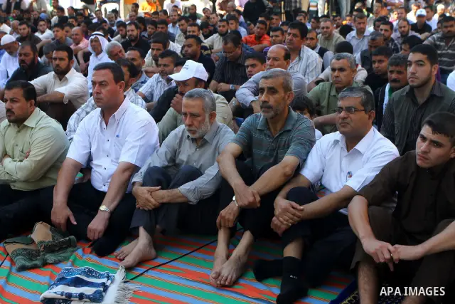 Palestinian Muslim worshippers attend Friday prayer next to the Red Cross building in Gaza City as they call for the release of Palestinian prisoners from Israeli jails and support of inmates in hunger strike on October...