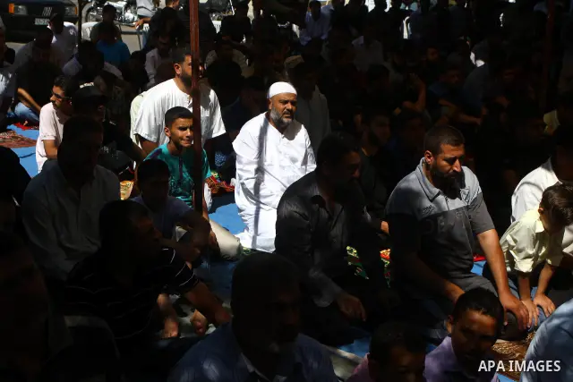 Palestinian Muslim worshippers attend Friday prayer next to the Red Cross building in Gaza City as they call for the release of Palestinian prisoners from Israeli jails and support of inmates in hunger strike on October...