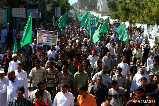 Palestinian Hamas supporters take part in a rally in Jabalya, northern Gaza Strip October 7, 2011, to show solidarity with Palestinian prisoners held in Israeli jails. Hundreds of Palestinians in Israeli jails have joine...