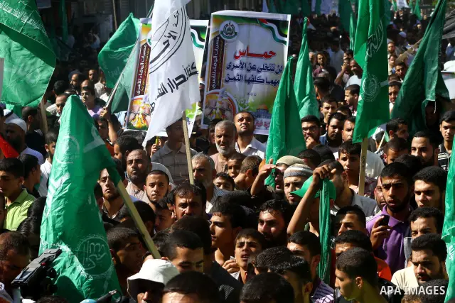 Palestinian Hamas supporters take part in a rally in Jabalya, northern Gaza Strip October 7, 2011, to show solidarity with Palestinian prisoners held in Israeli jails. Hundreds of Palestinians in Israeli jails have joine...