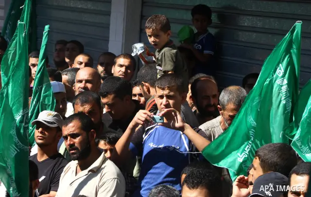 Palestinian Hamas supporters take part in a rally in Jabalya, northern Gaza Strip October 7, 2011, to show solidarity with Palestinian prisoners held in Israeli jails. Hundreds of Palestinians in Israeli jails have joine...