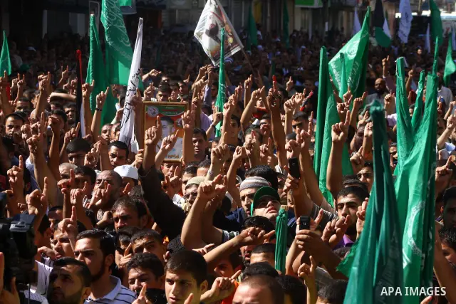 Palestinian Hamas supporters take part in a rally in Jabalya, northern Gaza Strip October 7, 2011, to show solidarity with Palestinian prisoners held in Israeli jails. Hundreds of Palestinians in Israeli jails have joine...