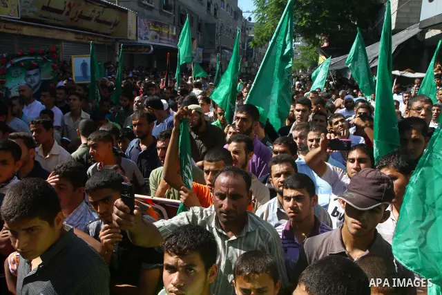 Palestinian Hamas supporters take part in a rally in Jabalya, northern Gaza Strip October 7, 2011, to show solidarity with Palestinian prisoners held in Israeli jails. Hundreds of Palestinians in Israeli jails have joine...
