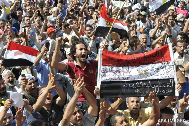 Egyptian demonstrators take part in a weekly protest in Tahrir Square, Cairo, Egypt, Friday, Oct. 7, 2011. Thousands of Egyptians protested Friday against the country's military rulers decision to retain the much hated e...
