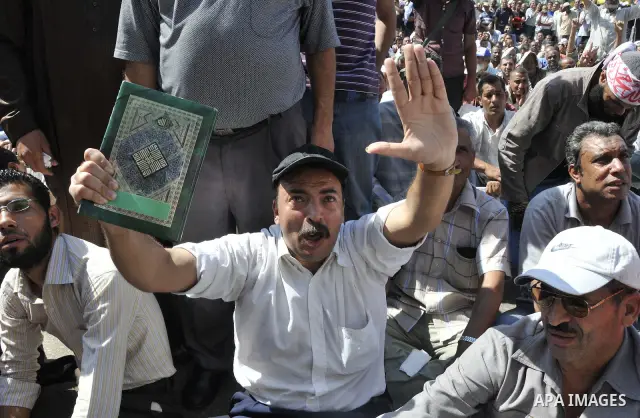 Egyptian demonstrators take part in a weekly protest in Tahrir Square, Cairo, Egypt, Friday, Oct. 7, 2011. Thousands of Egyptians protested Friday against the country's military rulers decision to retain the much hated e...