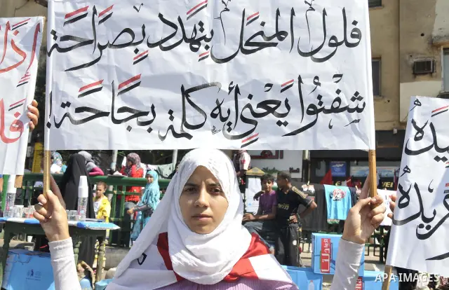 Egyptian demonstrators take part in a weekly protest in Tahrir Square, Cairo, Egypt, Friday, Oct. 7, 2011. Thousands of Egyptians protested Friday against the country's military rulers decision to retain the much hated e...