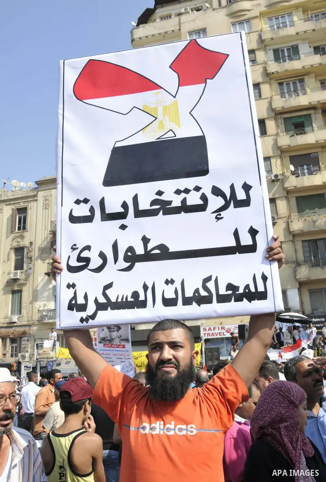 Egyptian demonstrators take part in a weekly protest in Tahrir Square, Cairo, Egypt, Friday, Oct. 7, 2011. Thousands of Egyptians protested Friday against the country's military rulers decision to retain the much hated e...