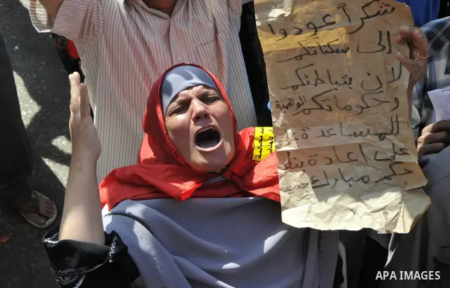 Egyptian demonstrators take part in a weekly protest in Tahrir Square, Cairo, Egypt, Friday, Oct. 7, 2011. Thousands of Egyptians protested Friday against the country's military rulers decision to retain the much hated e...