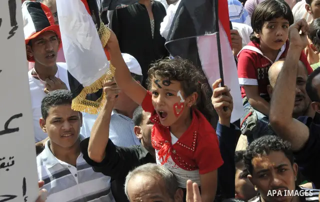 Egyptian demonstrators take part in a weekly protest in Tahrir Square, Cairo, Egypt, Friday, Oct. 7, 2011. Thousands of Egyptians protested Friday against the country's military rulers decision to retain the much hated e...