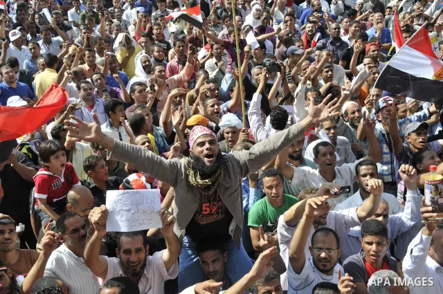 Egyptian demonstrators take part in a weekly protest in Tahrir Square, Cairo, Egypt, Friday, Oct. 7, 2011. Thousands of Egyptians protested Friday against the country's military rulers decision to retain the much hated e...