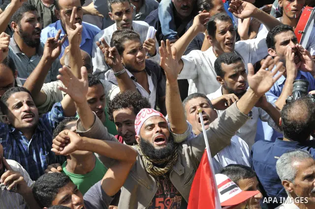 Egyptian demonstrators take part in a weekly protest in Tahrir Square, Cairo, Egypt, Friday, Oct. 7, 2011. Thousands of Egyptians protested Friday against the country's military rulers decision to retain the much hated e...