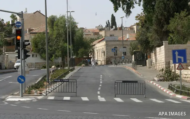 Israelis walks in the middle of an empty street during the Jewish holiday of Yom Kippur in Jerusalem, Saturday, Oct. 8, 2011. Yom Kippur, or "Day of Atonement," is the holiest of Jewish holidays when observant Jews atone...