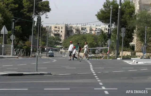 Israelis walks in the middle of an empty street during the Jewish holiday of Yom Kippur in Jerusalem, Saturday, Oct. 8, 2011. Yom Kippur, or "Day of Atonement," is the holiest of Jewish holidays when observant Jews atone...