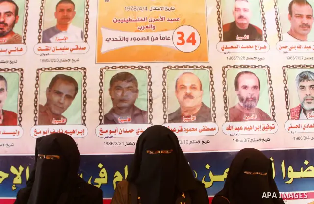 Palestinians take part in a protest in Gaza City Oct, 08, 2011, to show solidarity with Palestinian prisoners held in Israeli jails. Hundreds of Palestinians in Israeli jails have joined a hunger strike to protest agains...