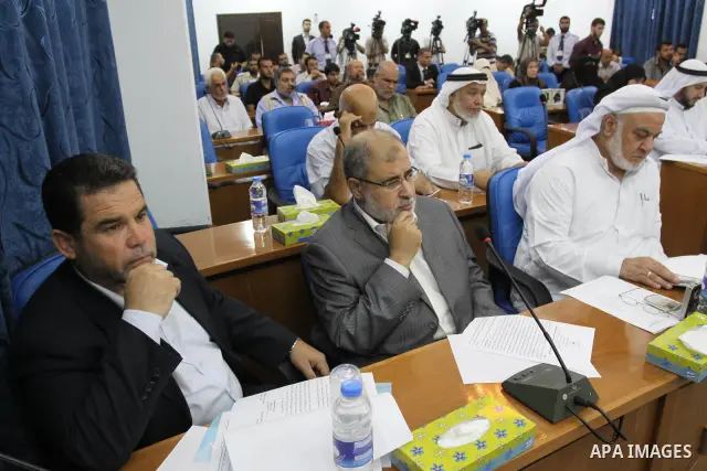 Members of Hamas Parliament attend a session of the Palestinian parliament parliament to discuss the issue of the Palestinian prisoners jailed in Israel, in Gaza City on Oct. 09, 2011. Photo by Mohammed Asad