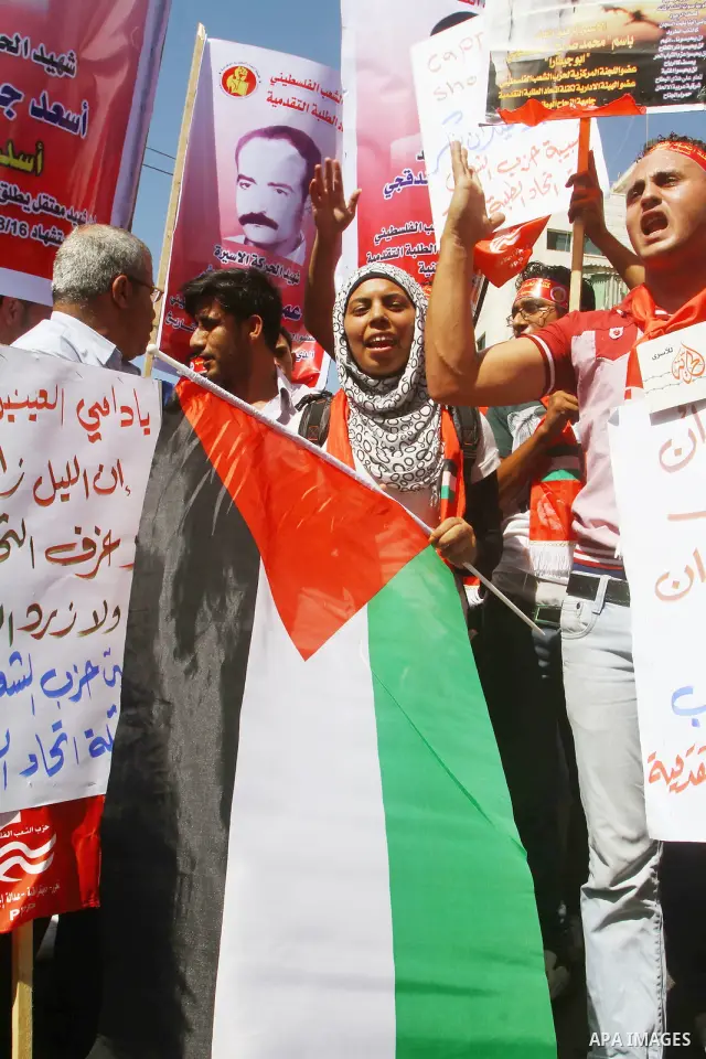 Palestinians shout during a demonstration calling for the release of prisoners from Israeli jails and in support of inmates on a hunger strike, on Oct,09, 2011, in Gaza City. Hundreds of Palestinians in Israeli jails hav...