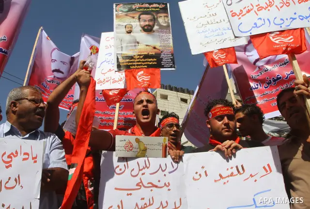 Palestinians shout during a demonstration calling for the release of prisoners from Israeli jails and in support of inmates on a hunger strike, on Oct,09, 2011, in Gaza City. Hundreds of Palestinians in Israeli jails hav...