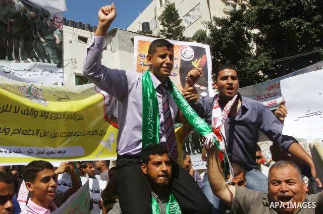 Palestinians shout during a demonstration calling for the release of prisoners from Israeli jails and in support of inmates on a hunger strike, on Oct,09, 2011, in Gaza City. Hundreds of Palestinians in Israeli jails hav...