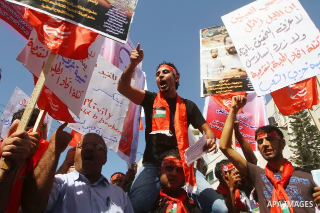 Palestinians shout during a demonstration calling for the release of prisoners from Israeli jails and in support of inmates on a hunger strike, on Oct,09, 2011, in Gaza City. Hundreds of Palestinians in Israeli jails hav...