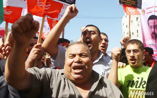 Palestinians shout during a demonstration calling for the release of prisoners from Israeli jails and in support of inmates on a hunger strike, on Oct,09, 2011, in Gaza City. Hundreds of Palestinians in Israeli jails hav...