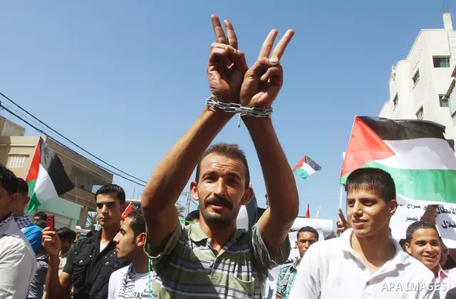 Palestinians shout during a demonstration calling for the release of prisoners from Israeli jails and in support of inmates on a hunger strike, on Oct,09, 2011, in Gaza City. Hundreds of Palestinians in Israeli jails hav...