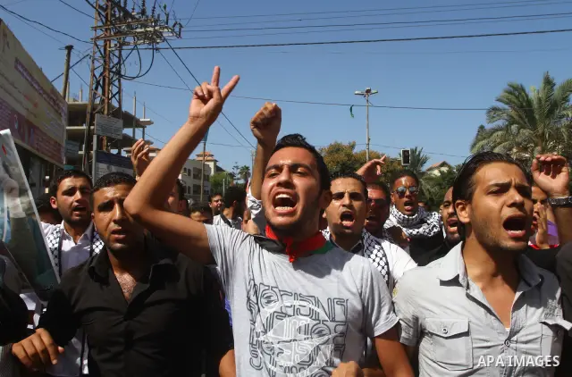 Palestinians shout during a demonstration calling for the release of prisoners from Israeli jails and in support of inmates on a hunger strike, on Oct,09, 2011, in Gaza City. Hundreds of Palestinians in Israeli jails hav...