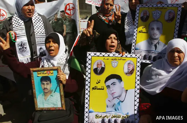 Palestinians shout during a demonstration calling for the release of prisoners from Israeli jails and in support of inmates on a hunger strike, on Oct,09, 2011, in Gaza City. Hundreds of Palestinians in Israeli jails hav...