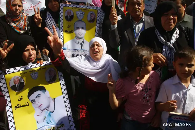 Palestinians shout during a demonstration calling for the release of prisoners from Israeli jails and in support of inmates on a hunger strike, on Oct,09, 2011, in Gaza City. Hundreds of Palestinians in Israeli jails hav...