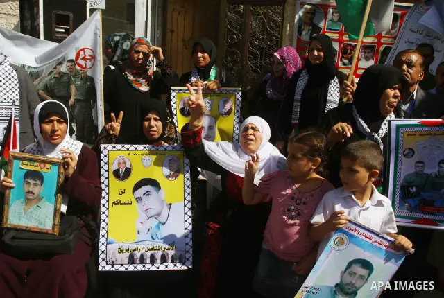 Palestinians shout during a demonstration calling for the release of prisoners from Israeli jails and in support of inmates on a hunger strike, on Oct,09, 2011, in Gaza City. Hundreds of Palestinians in Israeli jails hav...