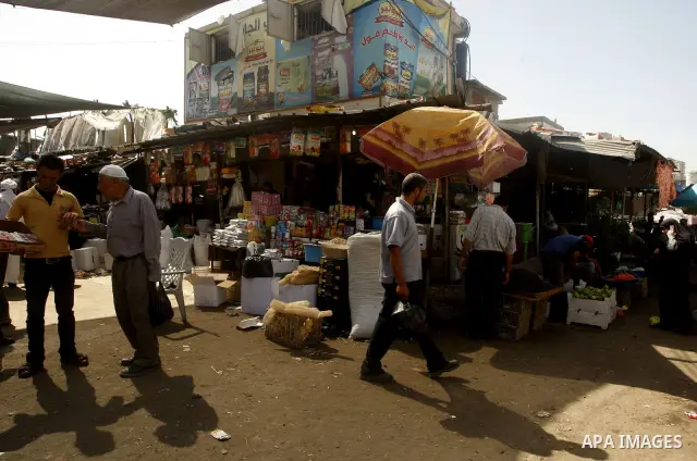 Palestinians shop at the old Fras market in Gaza city on Oct. 9,2011. A Palestinian investor rented Fras from the government in Gaza Strip to establish a large mall instead of the old market which oppose with refuse and...