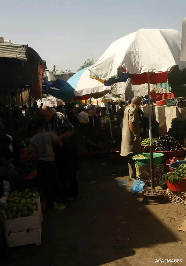 Palestinians shop at the old Fras market in Gaza city on Oct. 9,2011. A Palestinian investor rented Fras from the government in Gaza Strip to establish a large mall instead of the old market which oppose with refuse and...