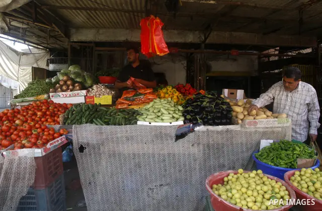 Palestinians shop at the old Fras market in Gaza city on Oct. 9,2011. A Palestinian investor rented Fras from the government in Gaza Strip to establish a large mall instead of the old market which oppose with refuse and...