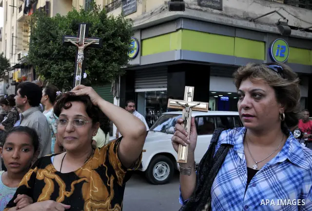 Egyptian Coptic Christians hold crosses and shout slogans, during a protest in Shubra, Cairo, 09 October 2011. According to media report, hundreds of Coptic Christians on 09 October, demonstrated outside the state televi...