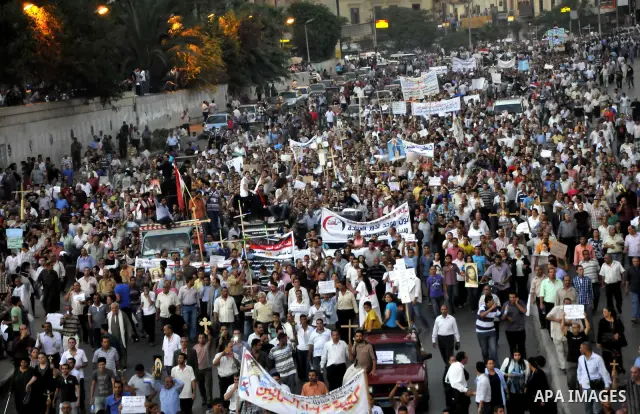 Egyptian Coptic Christians hold crosses and shout slogans, during a protest in Shubra, Cairo, 09 October 2011. According to media report, hundreds of Coptic Christians on 09 October, demonstrated outside the state televi...