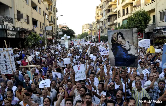 Egyptian Coptic Christians hold crosses and shout slogans, during a protest in Shubra, Cairo, 09 October 2011. According to media report, hundreds of Coptic Christians on 09 October, demonstrated outside the state televi...
