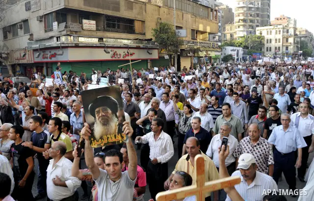Egyptian Coptic Christians hold crosses and shout slogans, during a protest in Shubra, Cairo, 09 October 2011. According to media report, hundreds of Coptic Christians on 09 October, demonstrated outside the state televi...