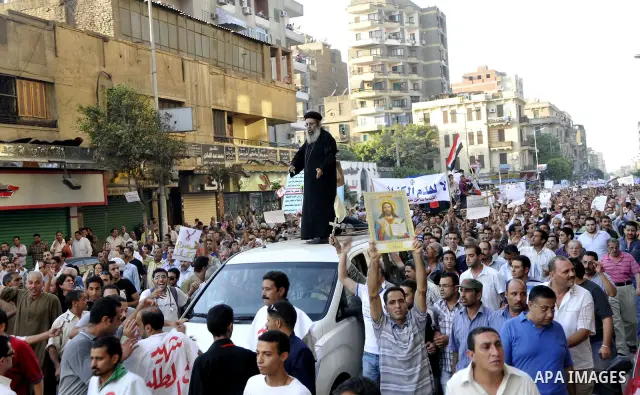 Egyptian Coptic Christians hold crosses and shout slogans, during a protest in Shubra, Cairo, 09 October 2011. According to media report, hundreds of Coptic Christians on 09 October, demonstrated outside the state televi...