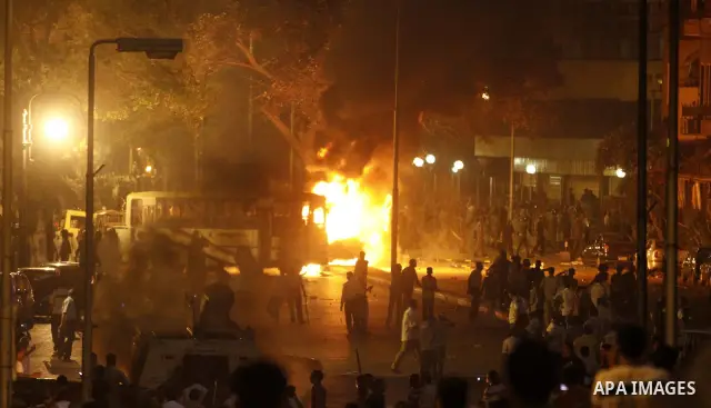 Coptic Egyptian demonstrators gather by a burning army vehicle during cashes with Egyptian Army soldiers following a demonstration in Cairo, Egypt Sunday, Oct. 9, 2011. Egyptian state television reports at least one sold...