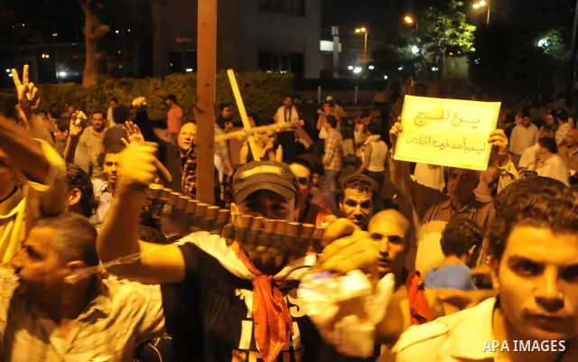 Coptic Egyptian demonstrators gather by during cashes with Egyptian Army soldiers following a demonstration in Cairo, Egypt Sunday, Oct. 9, 2011. Egyptian state television reports at least one soldier has been killed in...