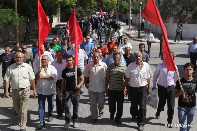 Palestinians protest during a demonstration calling for the release of prisoners from Israeli jails and in support of inmates on a hunger strike, on October 10, 2011, in Gaza City. Hundreds of Palestinians in Israeli jai...