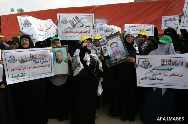 Palestinian women take part in a protest calling for the release of Palestinian prisoners from Israeli jails and in support of inmates in hunger strike on Oct 11, 2011 in Rafah, southern Gaza Strip. Hundreds of Palestini...