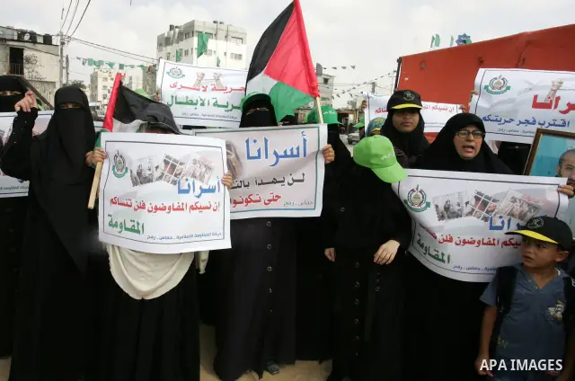 Palestinian women take part in a protest calling for the release of Palestinian prisoners from Israeli jails and in support of inmates in hunger strike on Oct 11, 2011 in Rafah, southern Gaza Strip. Hundreds of Palestini...