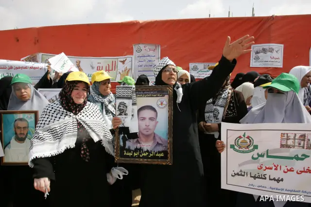 Palestinian women take part in a protest calling for the release of Palestinian prisoners from Israeli jails and in support of inmates in hunger strike on Oct 11, 2011 in Rafah, southern Gaza Strip. Hundreds of Palestini...