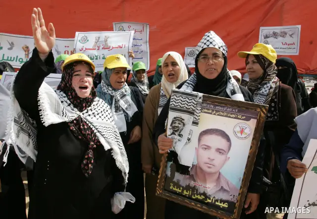 Palestinian women take part in a protest calling for the release of Palestinian prisoners from Israeli jails and in support of inmates in hunger strike on Oct 11, 2011 in Rafah, southern Gaza Strip. Hundreds of Palestini...