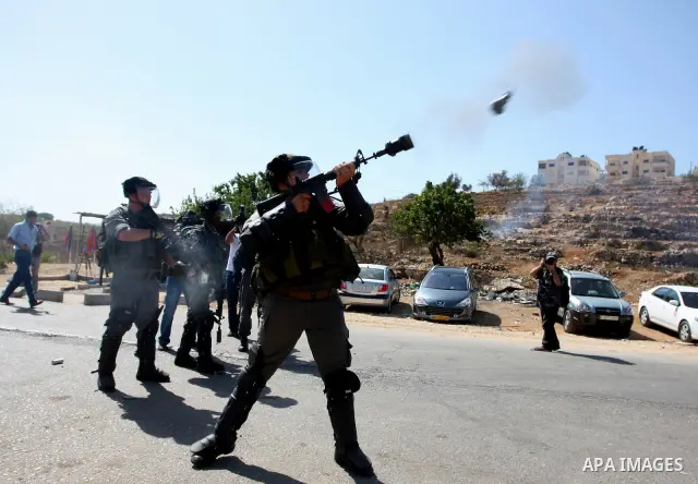 Israeli forces clash with Palestinian protestors following a demonstration calling for the release of prisoners held in Israeli jails and in support of inmates in hunger strike, on October 11, 2011 near Israel's Ofer pri...